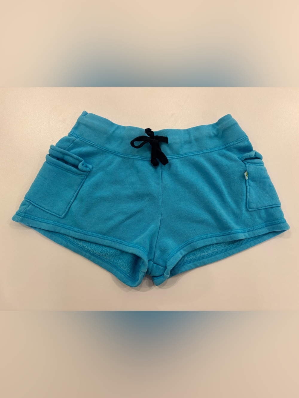 If lost return to Love Junkie Turquoise Athletic Shorts with Black Drawstring